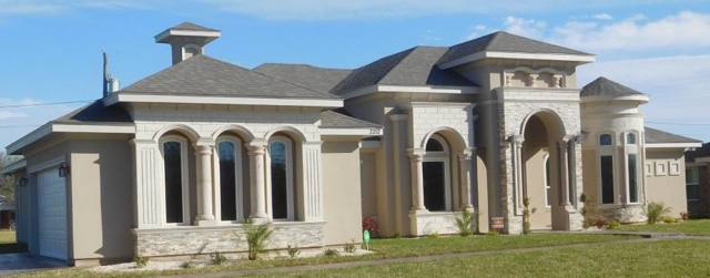 Stucco custom home with arched windows, McAllen TX
