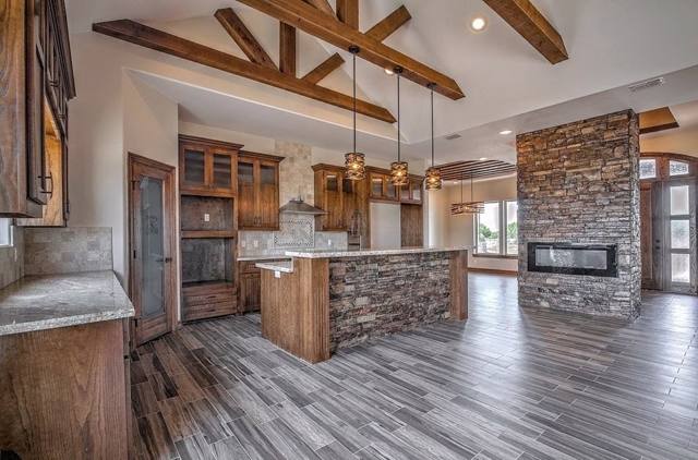 Finished kitchen with stone accent wall